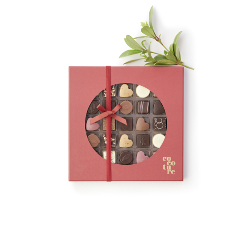 Billede af Fyldte chokolader og konfektstykker i rød Cocoture æske